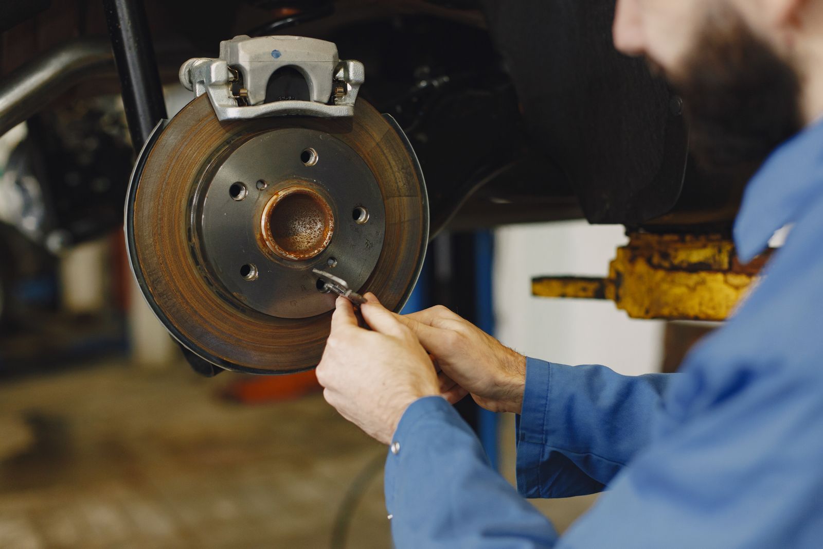 Hands fitting a brake rotor