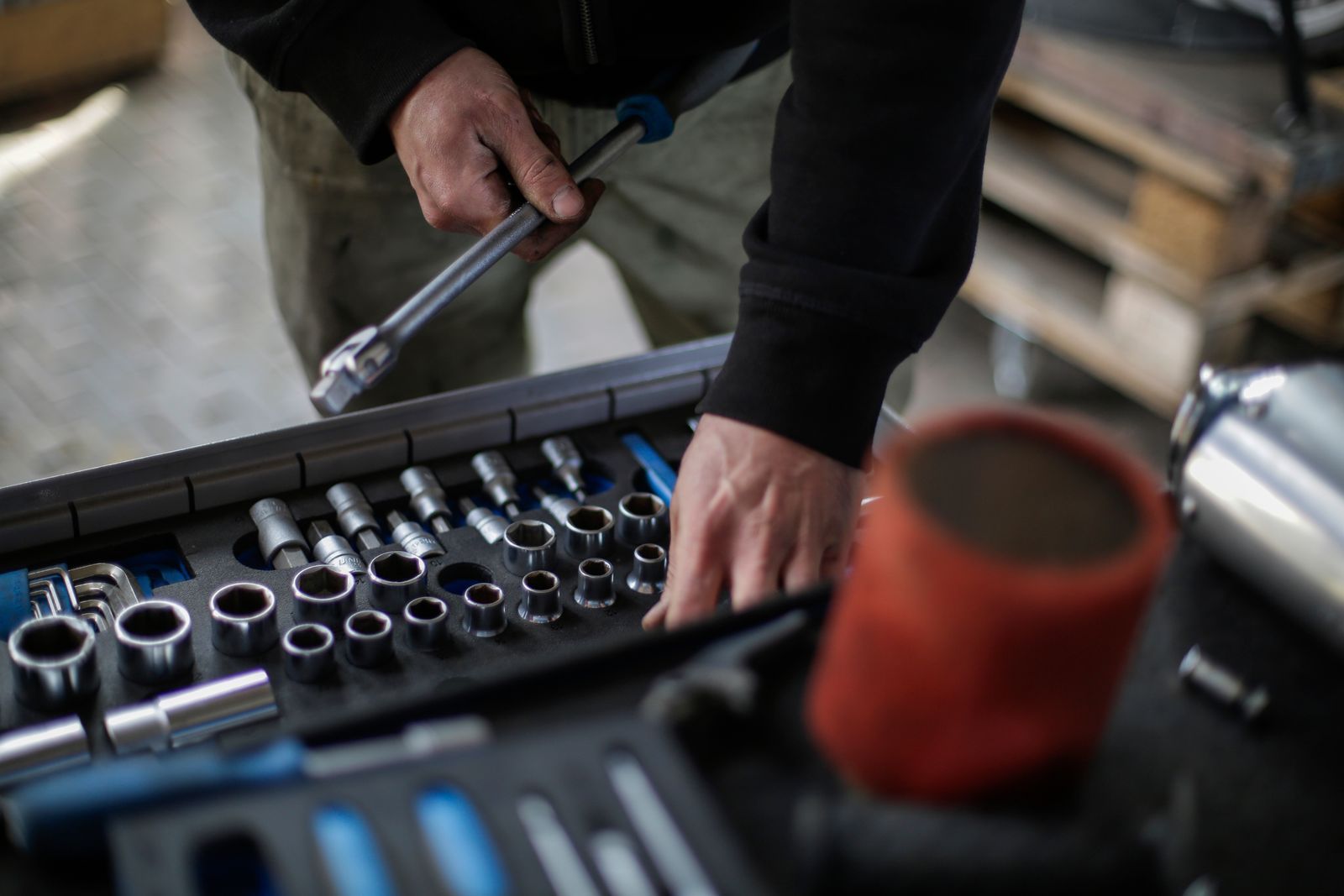 A socket set laid out on the bench