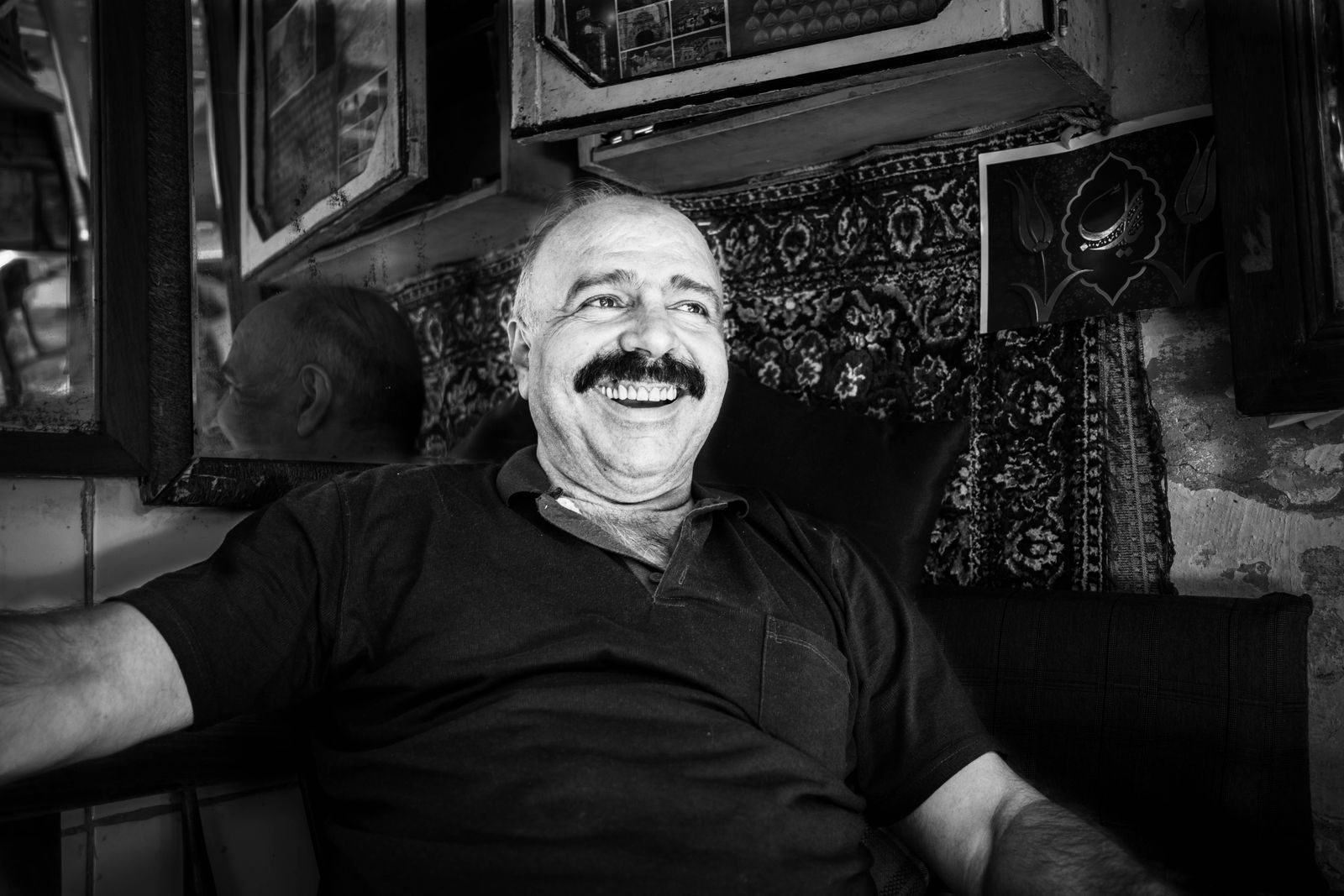 Marc Gagnon laughing in the shop, black and white