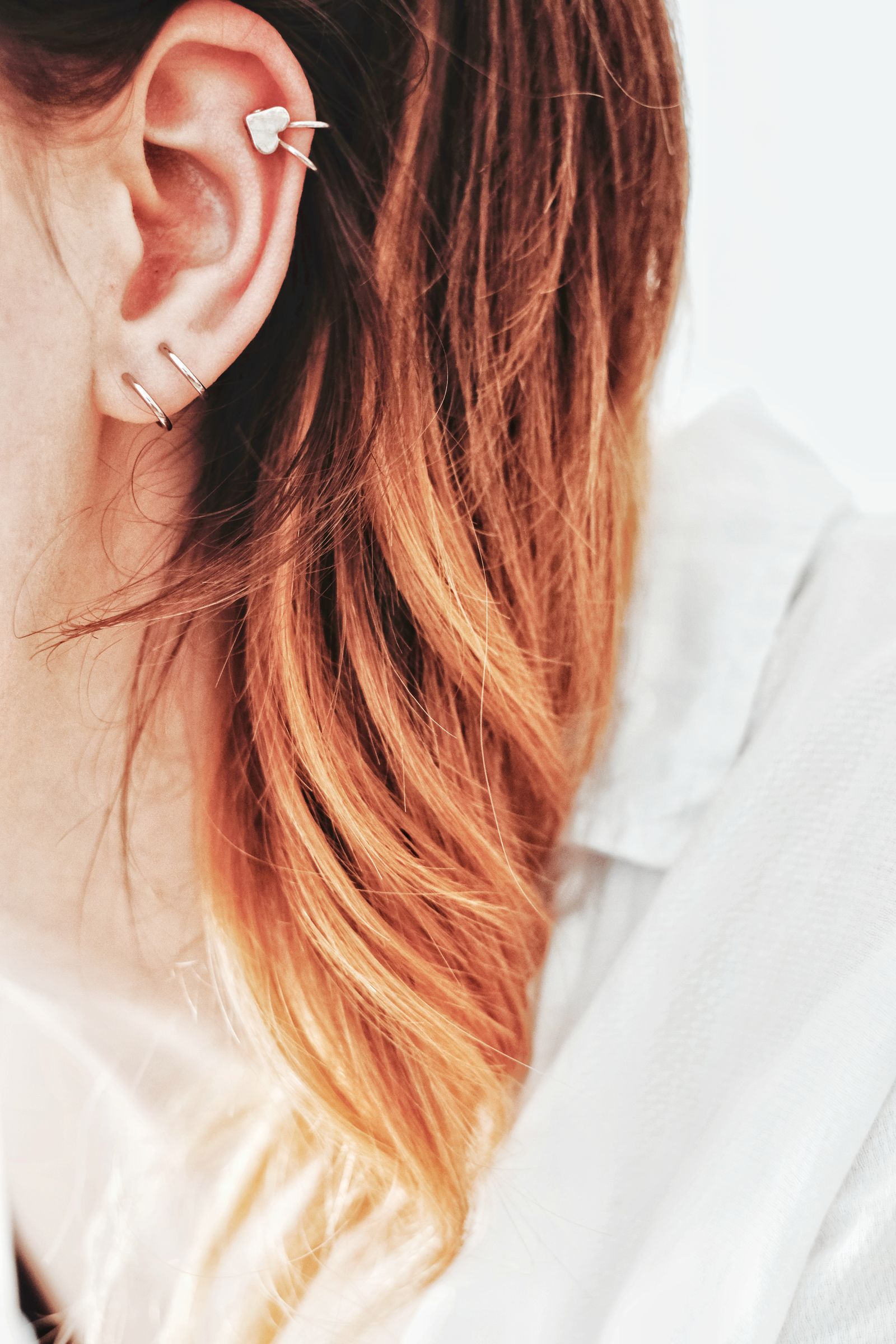 An ear with several small studs up the helix