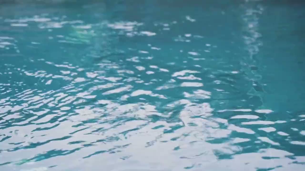 Slow ripples on clear blue water