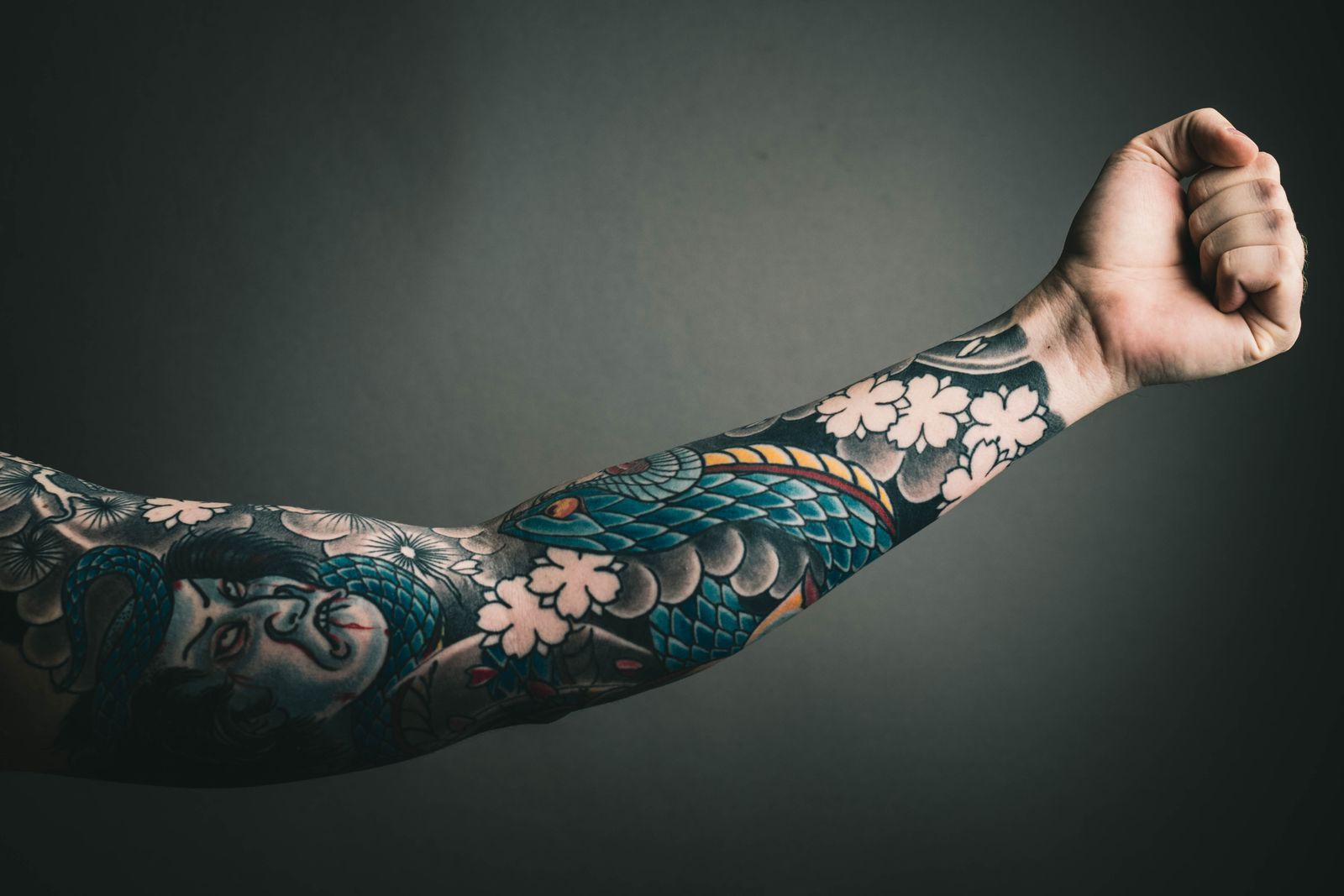 A fist with a full colour sleeve