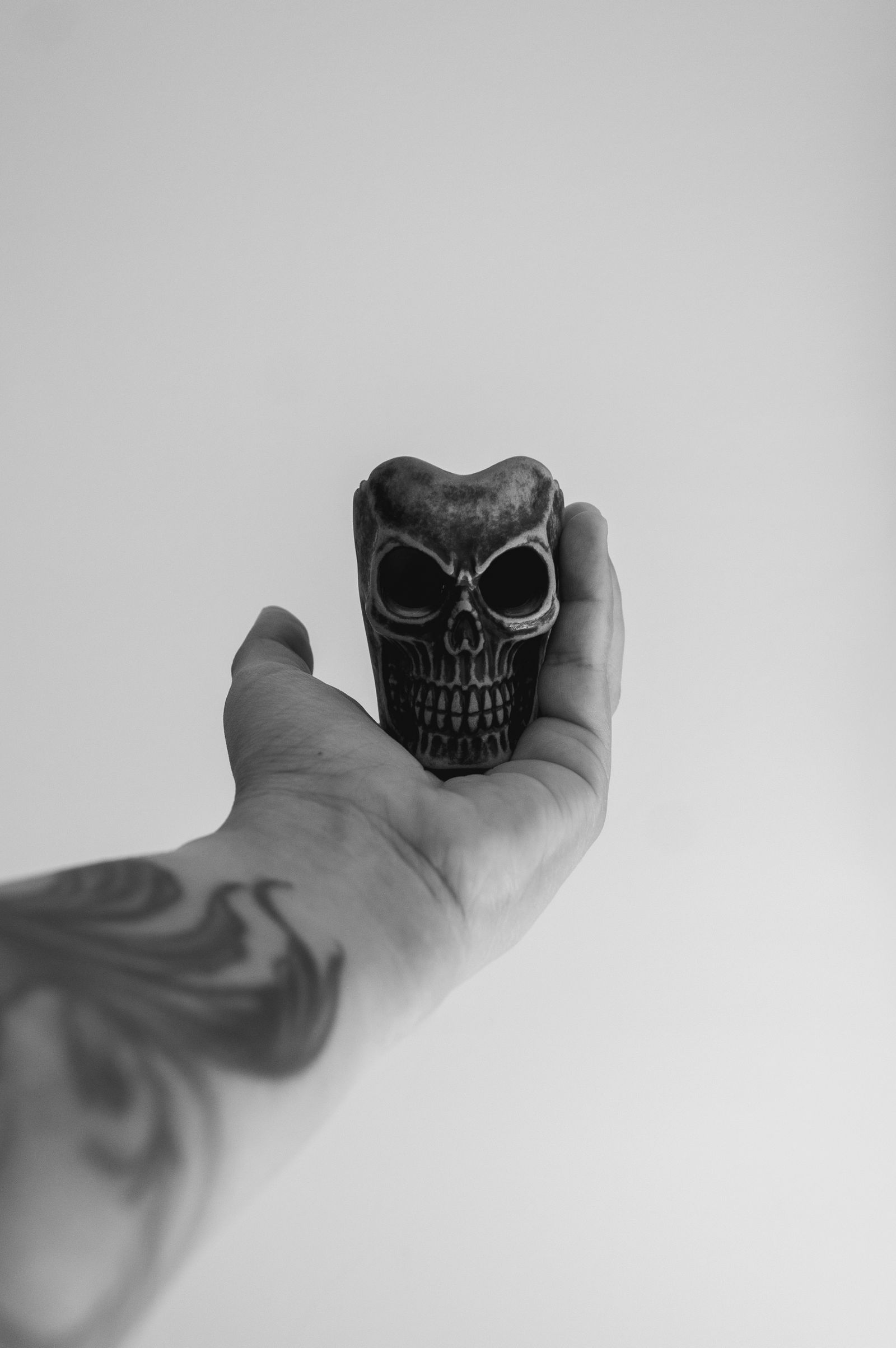 A skull tattoo on a hand